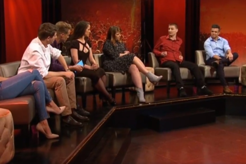 Adrian (red shirt) was accused of manspreading