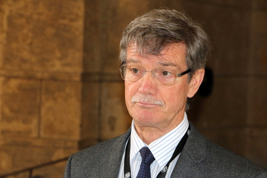 A head and shoulder shot of Mike Nahan with a serious expression.