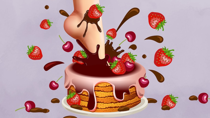 a foot stepping into a cake with strawberries flying out.