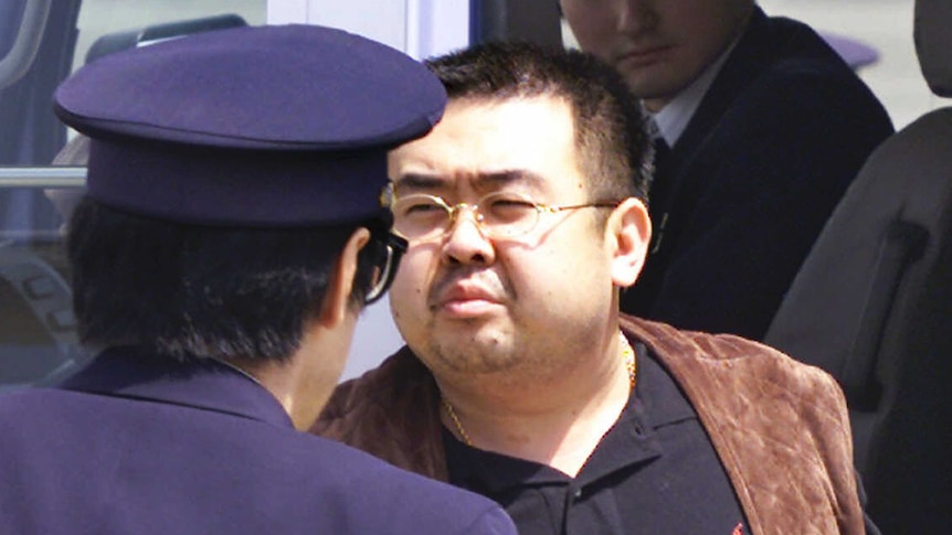 Kim Jong-nam escorted by officials