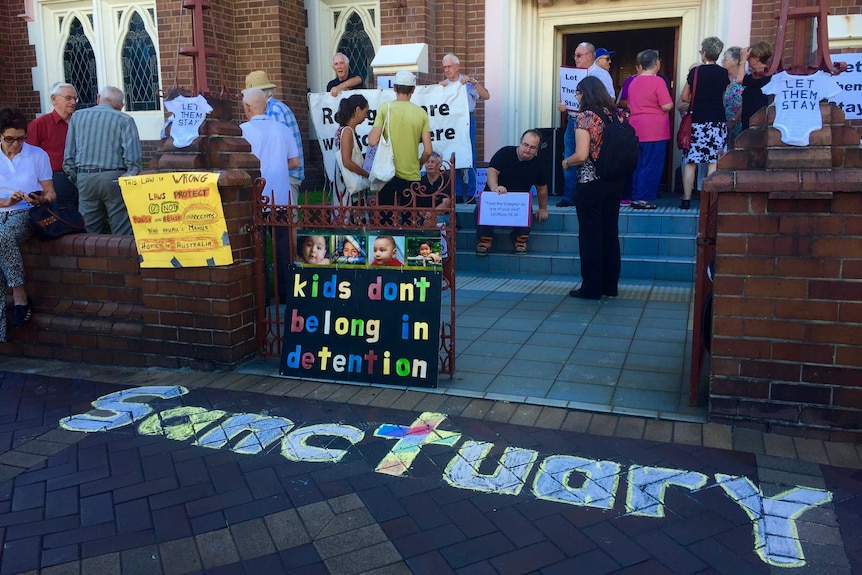 Newcastle people rally outside Newcastle' Wesley Uniting Church in support of asylum seekers.