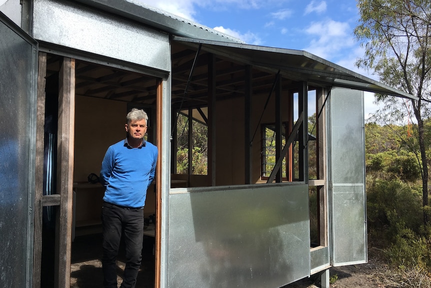 Bushfire landscape architect Ian Weir standing in the doorway