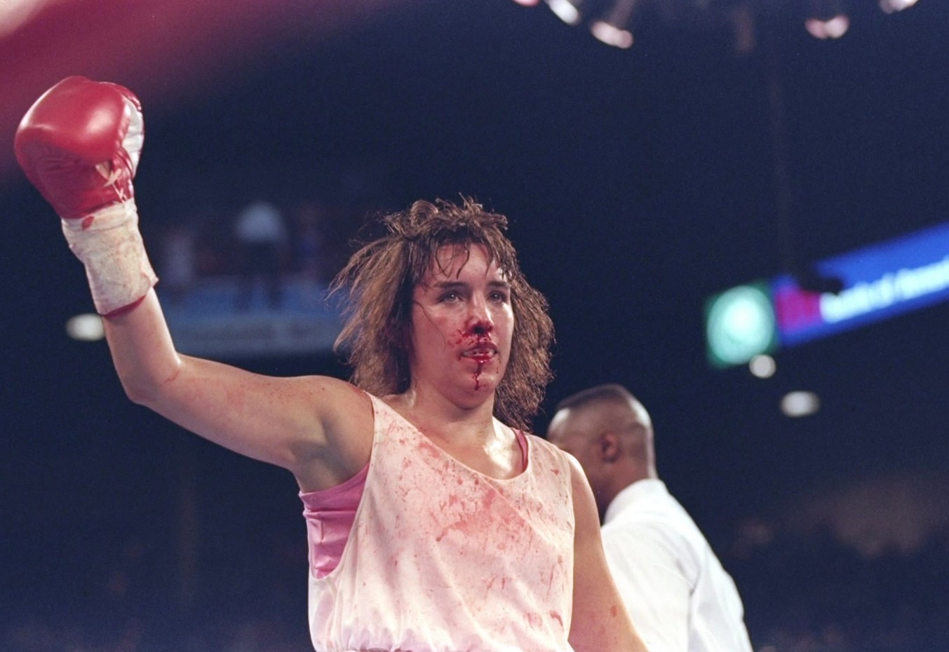 A woman wearing boxing gloves.