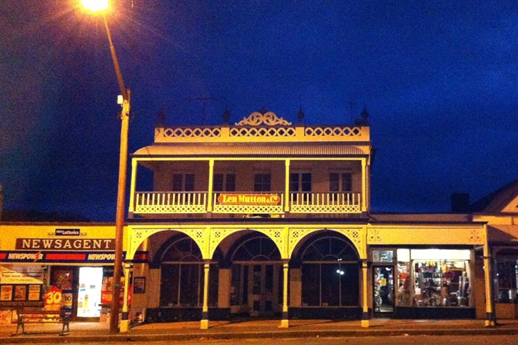 Facade of Len Mutton & Co at dusk.