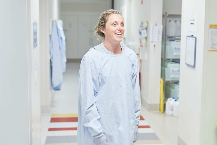 Rowen Bull stands in a lab.