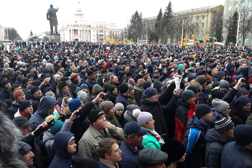 Crowds gathered in a public space.