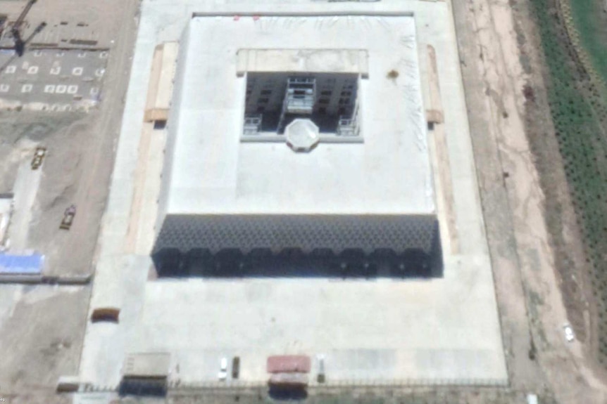 Satellite image of Golden Future's factory in Kashgar. Taken from Google Earth. The factory building is a big cube.