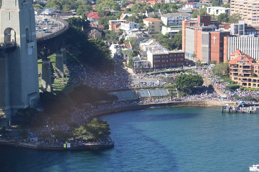 Aerial view of crowds packed along the Sydney foreshore at Kirribilli for the fireworks.