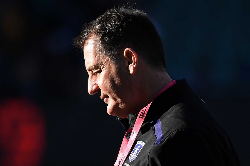 A profile shot of Ross Lyon looking down