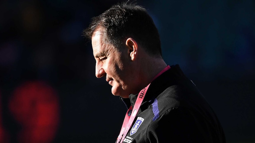 A profile shot of Ross Lyon looking down