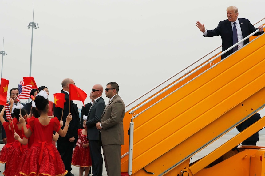 US President Donald Trump boards Air Force One to depart for the Philippines.