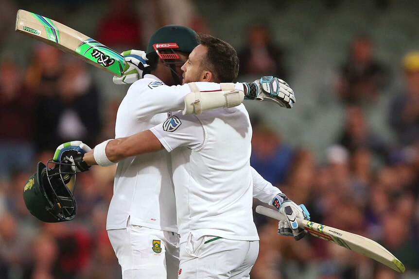 Faf Du Plessis gets a hug after making a century