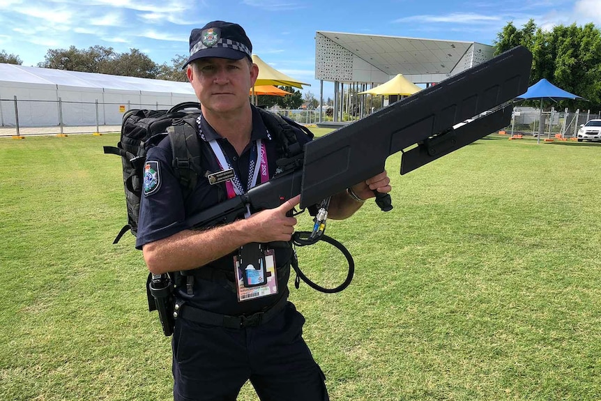 Senior Sergeant John Hilderbrand with a drone gun