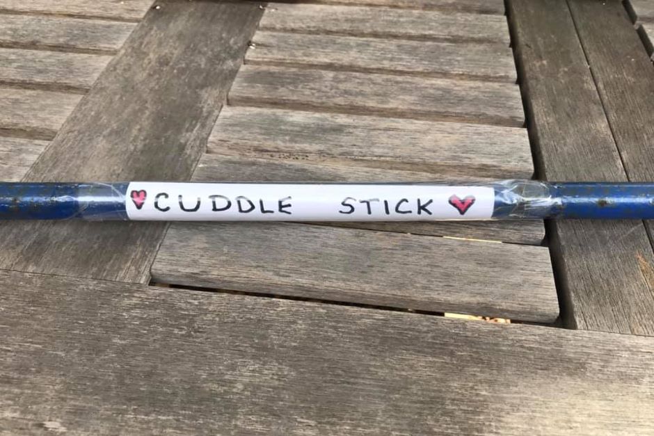 Stick with 'cuddle stick' label on it