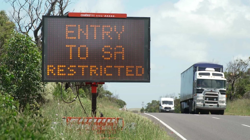 Sign on highway says "entry to SA restricted".