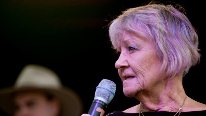 Jan Clifford speaks into a microphone