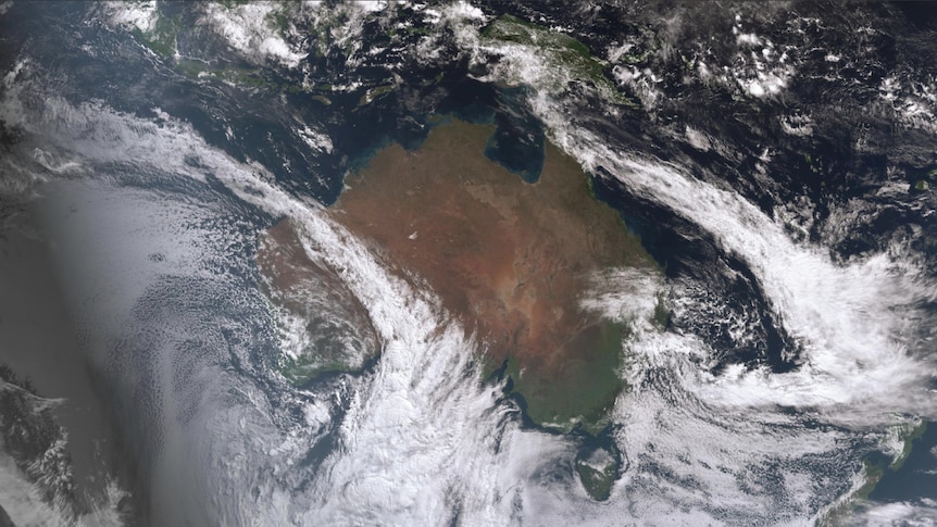 Satellite images showing two diagonal stripes of cloud crossing Australia.