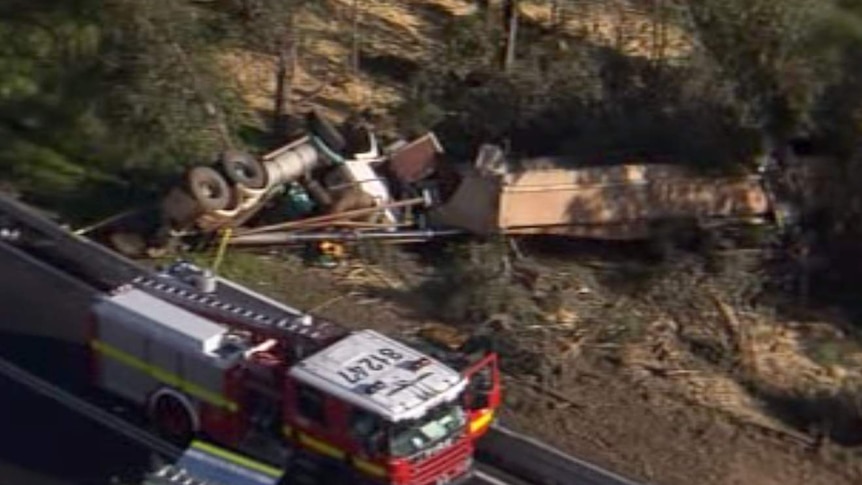 The overturned truck and trailer after the crash near Dwellingup