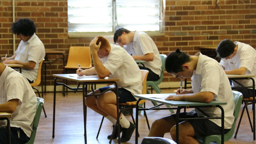 Boys sitting a school exam.