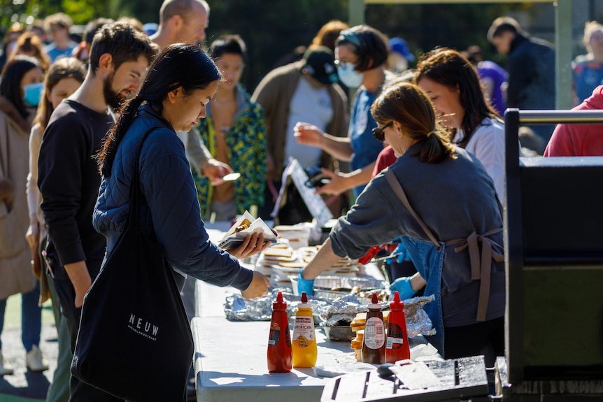 Voters buying sausages at a primary school on election day.