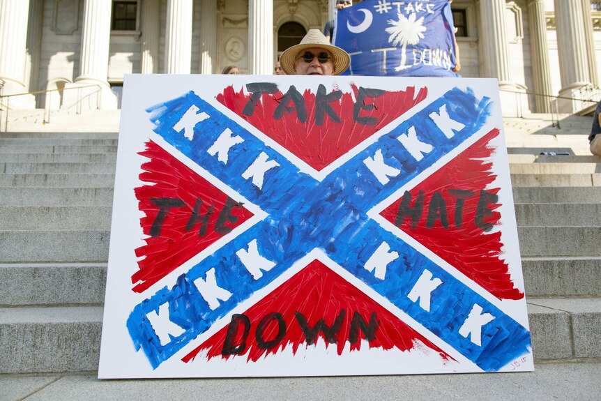 A demonstrator calls for the removal of the confederate flag in South Carolina