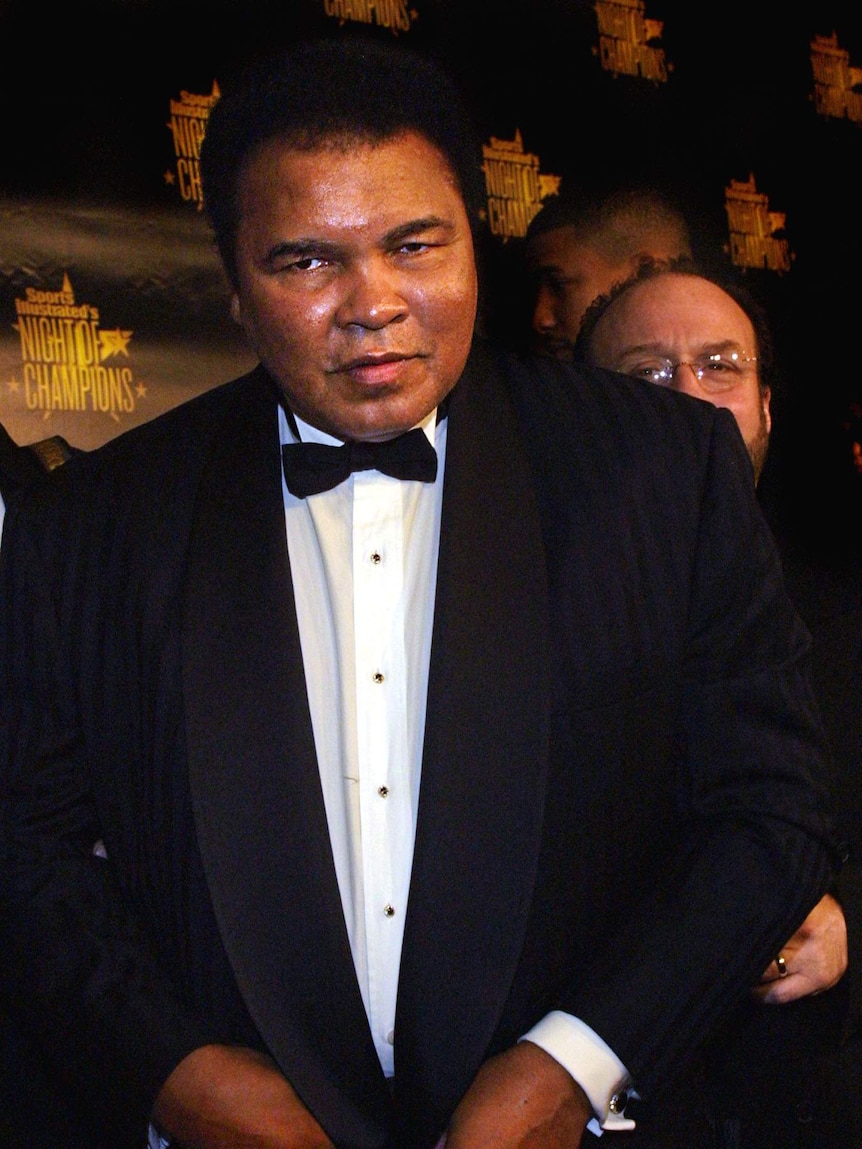 Muhammad Ali in a suit arrives for the taping of Sports Illustrated's Night of Champions
