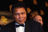 Muhammad Ali in a suit arrives for the taping of Sports Illustrated's Night of Champions