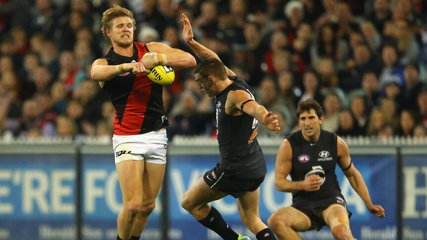 Hurley contests for the ball against Carlton