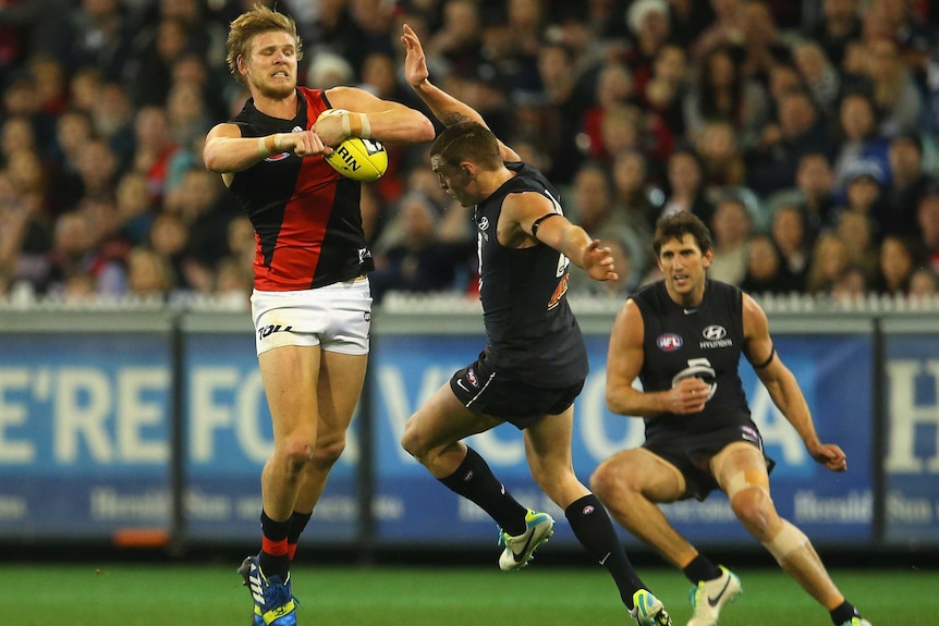 Hurley contests for the ball against Carlton