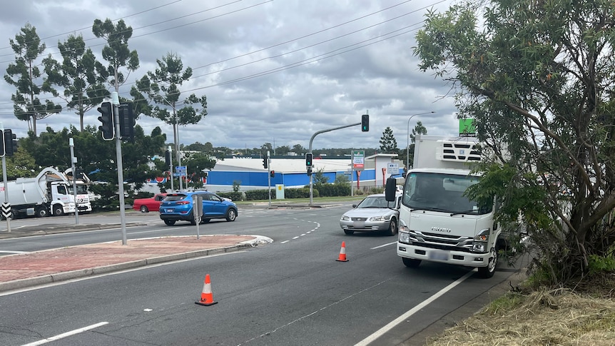 A light truck parked on the side of the road.