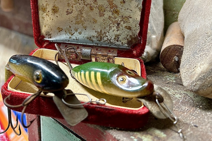 Old fishing lures in velvet box