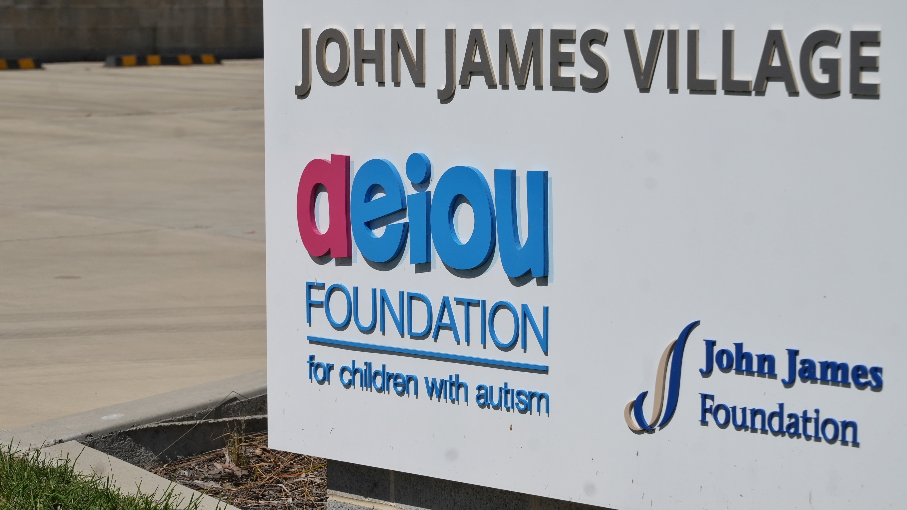 A sign that reads "aeiou foundation for children with autism".