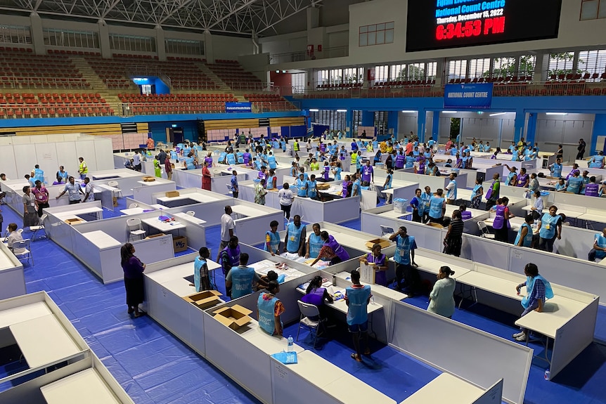 Electoral workers inside vote counting centre.
