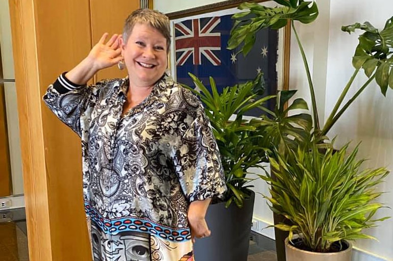 Woman poses as she dressed up for #FormalFriday at Parliament House in Canberra.