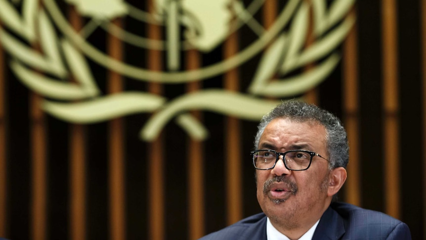 a headshot of Tedros Adhanom Ghebreyesus, Director General of the World Health Organization with the company's logo in the back