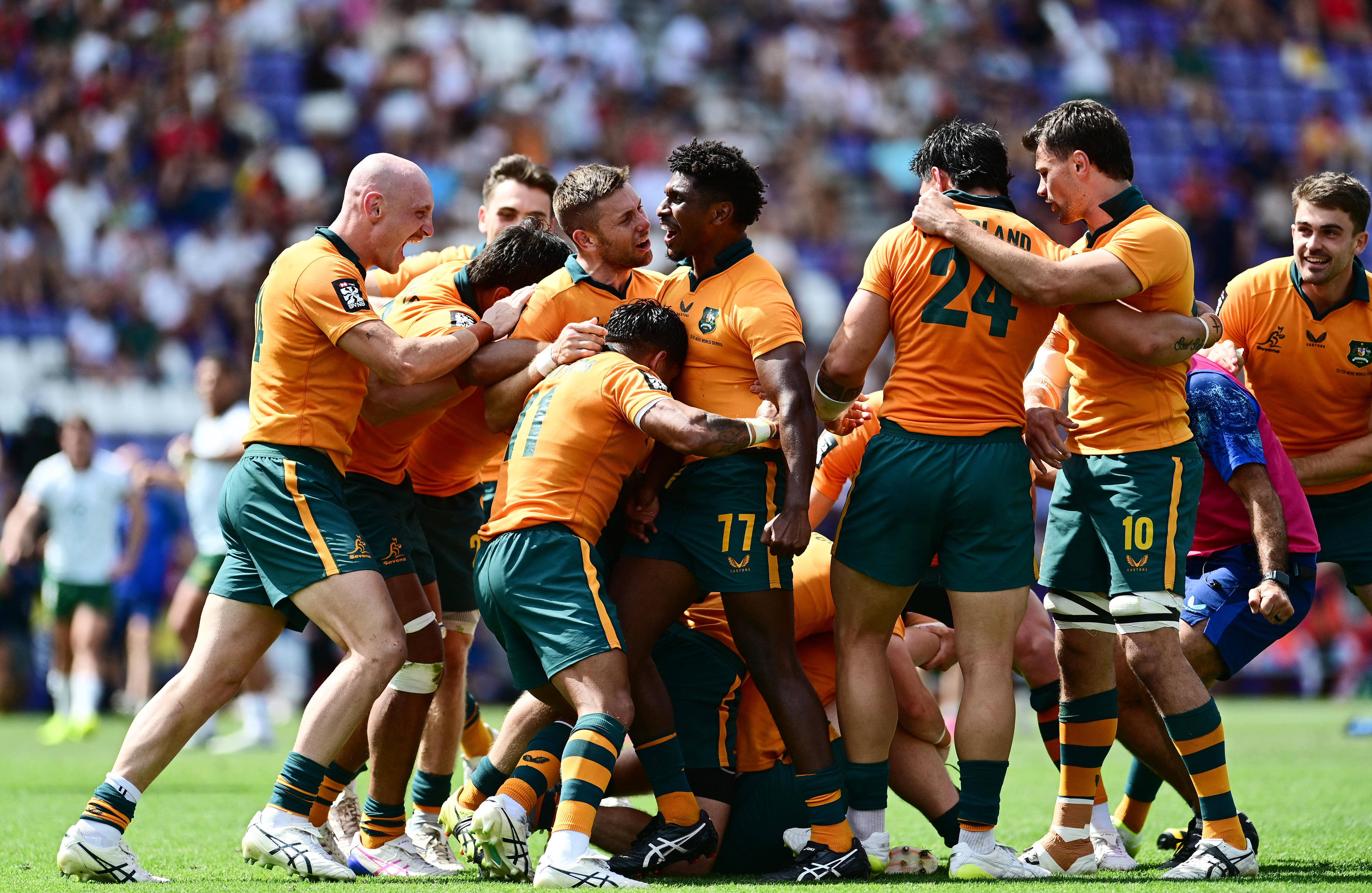 Australia celebrates defeating South Africa in the men's final at the rugby sevens World Championship leg in Spain.