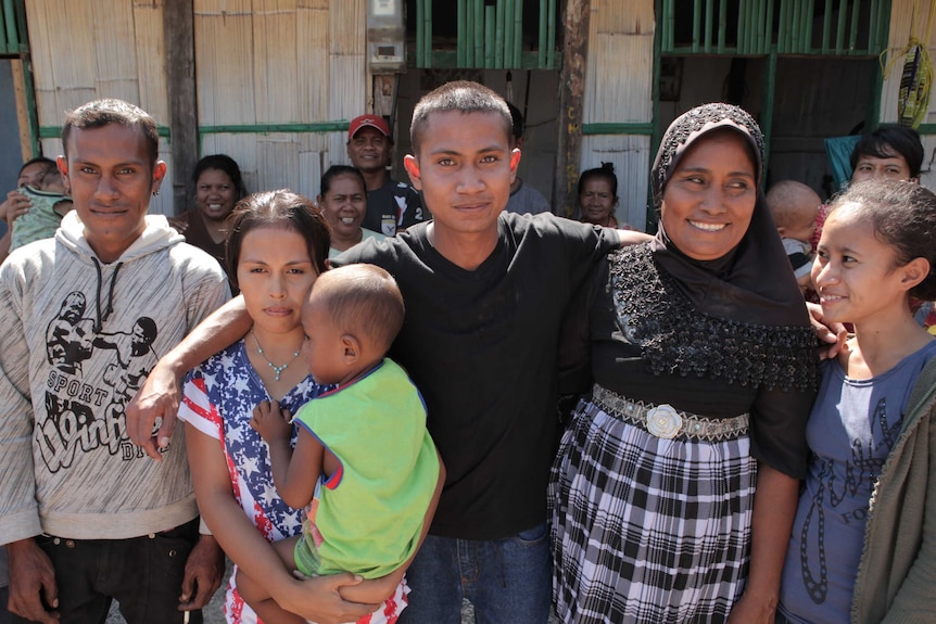 Ali Jasmin with his arms around family members shortly after he was released from a WA jail.