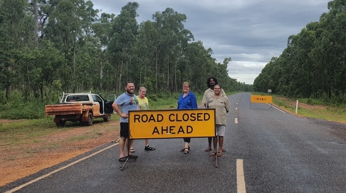 Road closed ahead sign on remote road