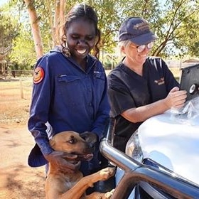 Roper Gulf Regional Council vet Sam Phelan is standing with an indigenous ranger in a remote community.