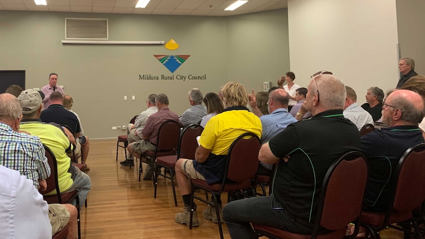 Mick Keelty speaks to a room full of people in Mildura.