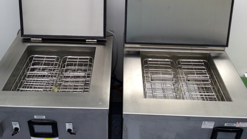 Two stainless steel machines side by side