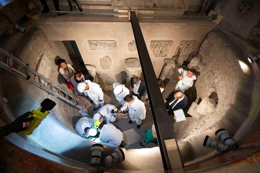 Experts open the ossuary at the Teutonic Cemetery in the Holy See, Vatican City.