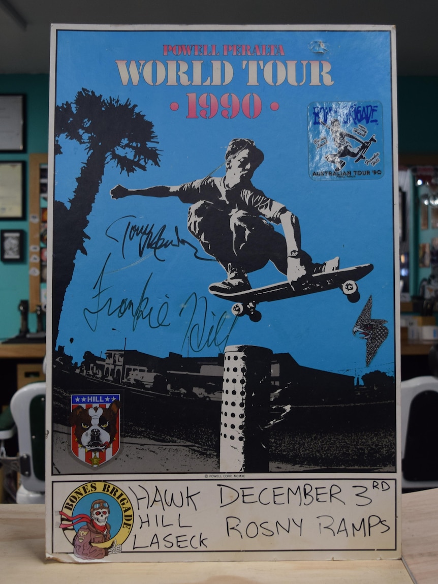 Blue poster with skateboarder on it, reads Powell Peralta World Tour 1990