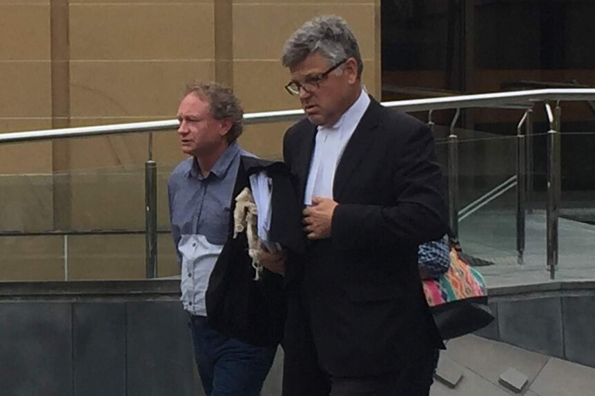 Convicted arsonist Paul Raymond Doyle leaves the Supreme Court with his lawyer Greg Barns