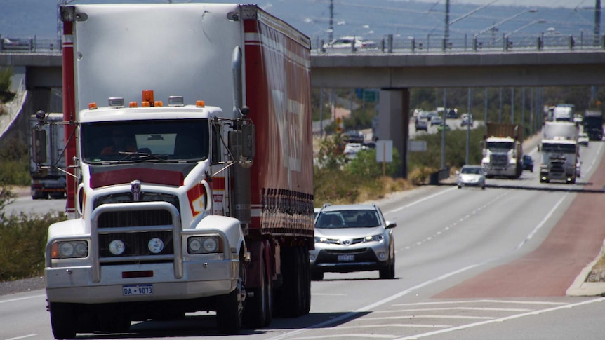 A truck travels along a Highway.