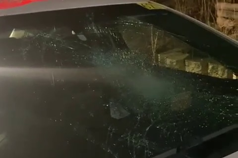 A smashed front windscreen of a car