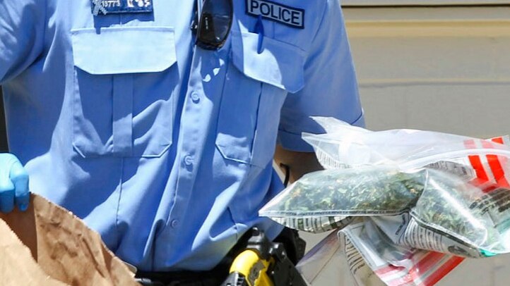 Police officer carrying illegal drugs
