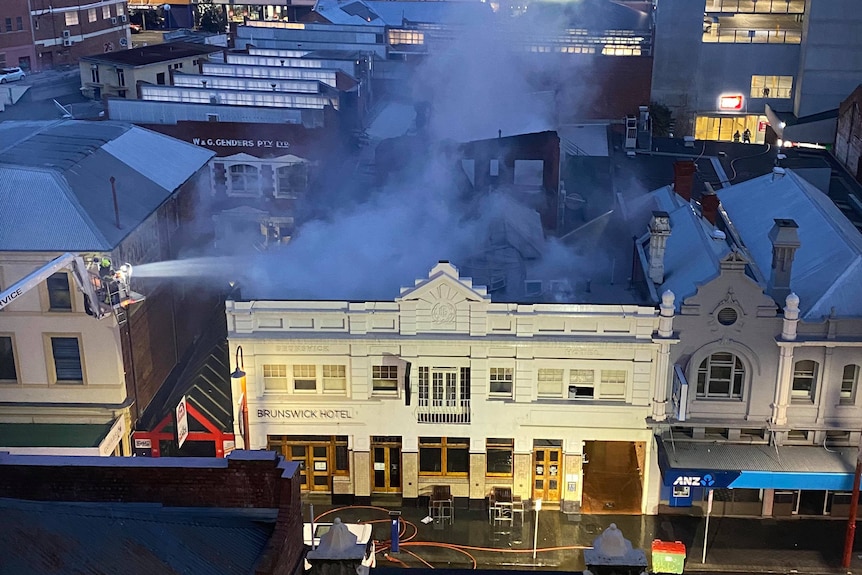 Smoke rises from the Brunswick Hotel in Hobart. Pic taken from above.