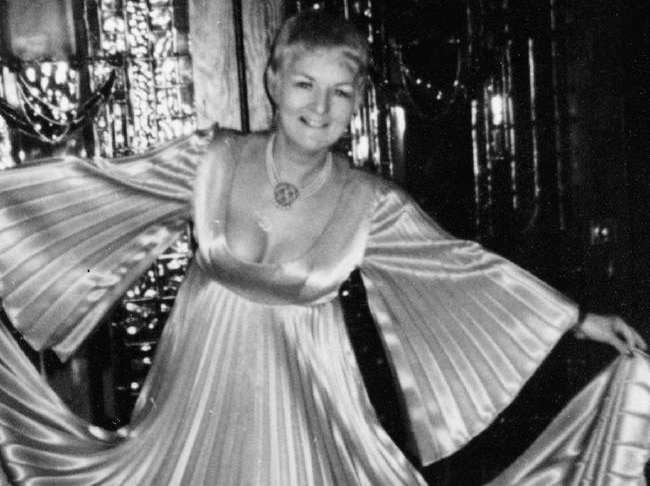 A black and white photo of Shirley Finn wearing a flowing ball gown.