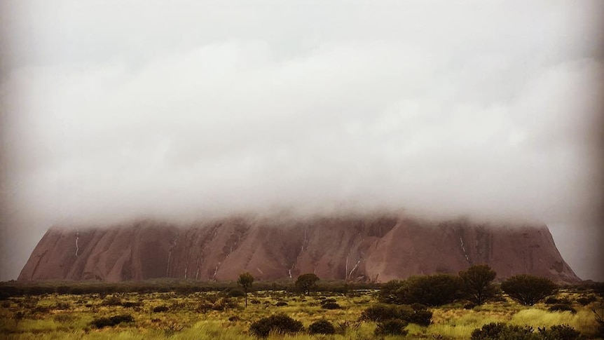 Low cloud hangs over Uluru